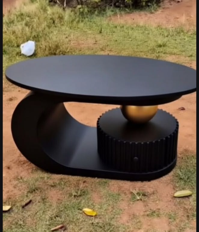 Modern Black Sculptural Oval Coffee Table with Gold Orb Accent